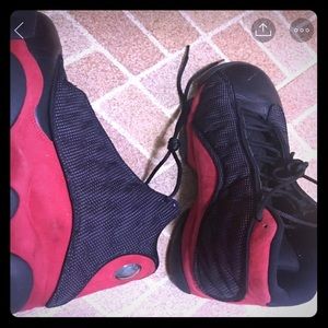 Red and black Jordan 13’s